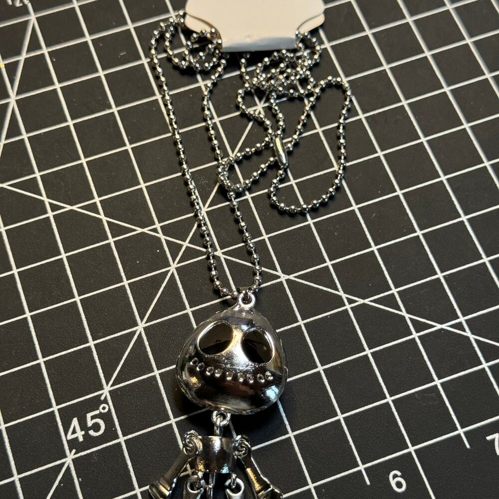 Silver tone dangle alien, skeleton pendant necklace.  Gothic punk emo
